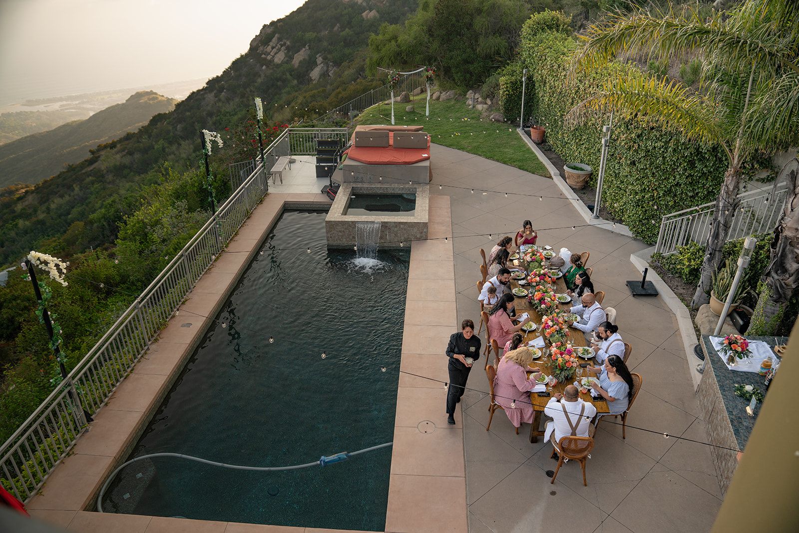 private estate micro wedding in Malibu, Dinner and String Lights by the Pool