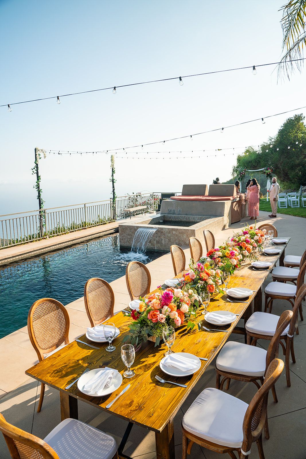 private estate micro wedding, malibu, Dinner and String Lights by the Pool