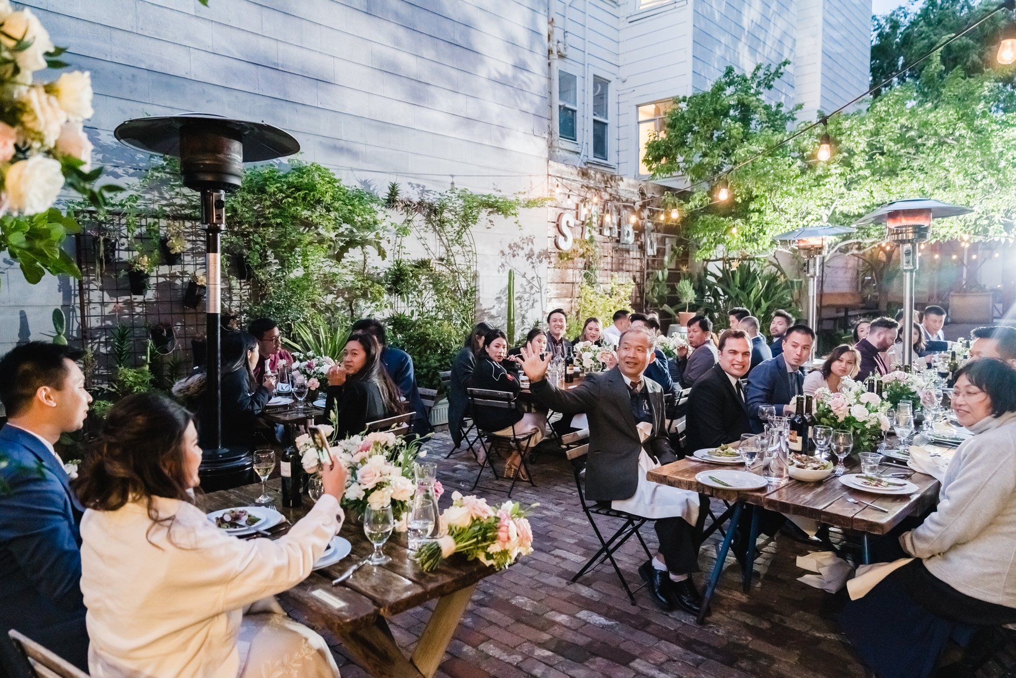 industrial-cafe micro wedding at Stable Cafe, Dinner on the String-Lit Patio at Stable Cafe