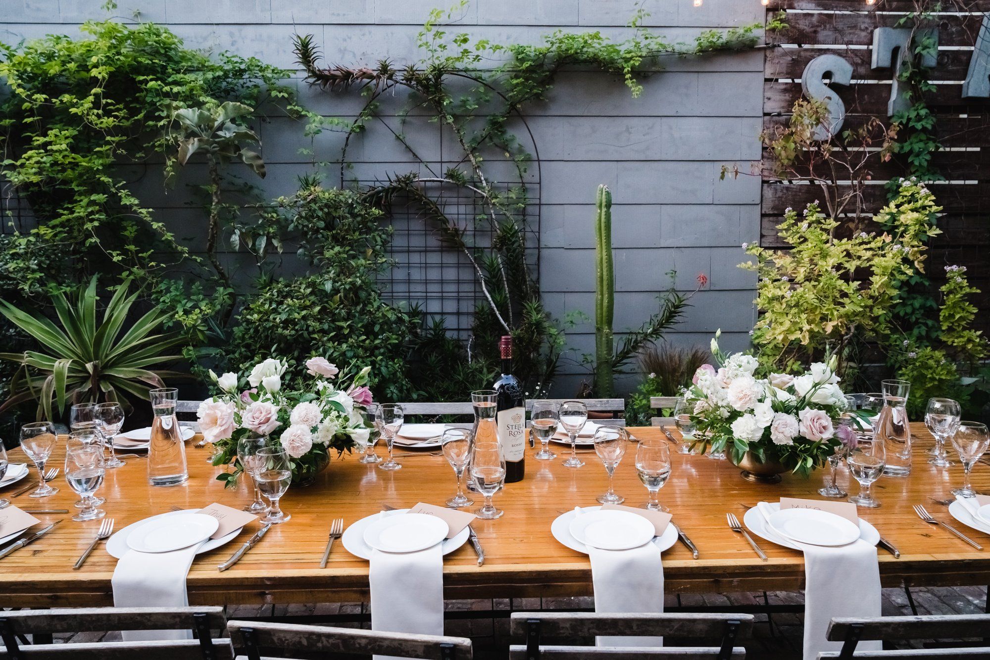 industrial-cafe micro wedding at Stable Cafe, Dinner on the String-Lit Patio at Stable Cafe