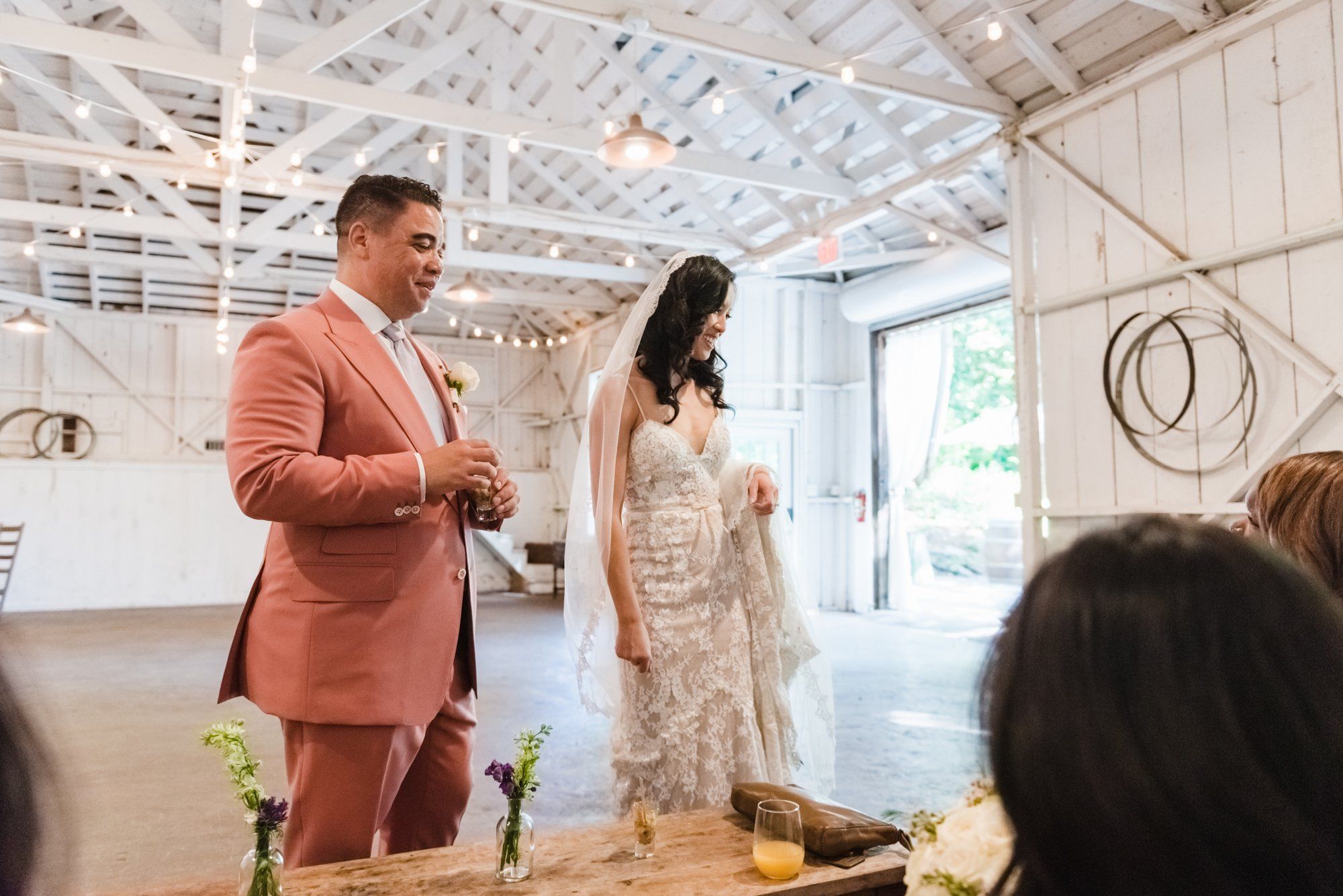 multicultural spring wedding at sand rock farm, A Family-Style Spring Dinner in the Barrel Room
