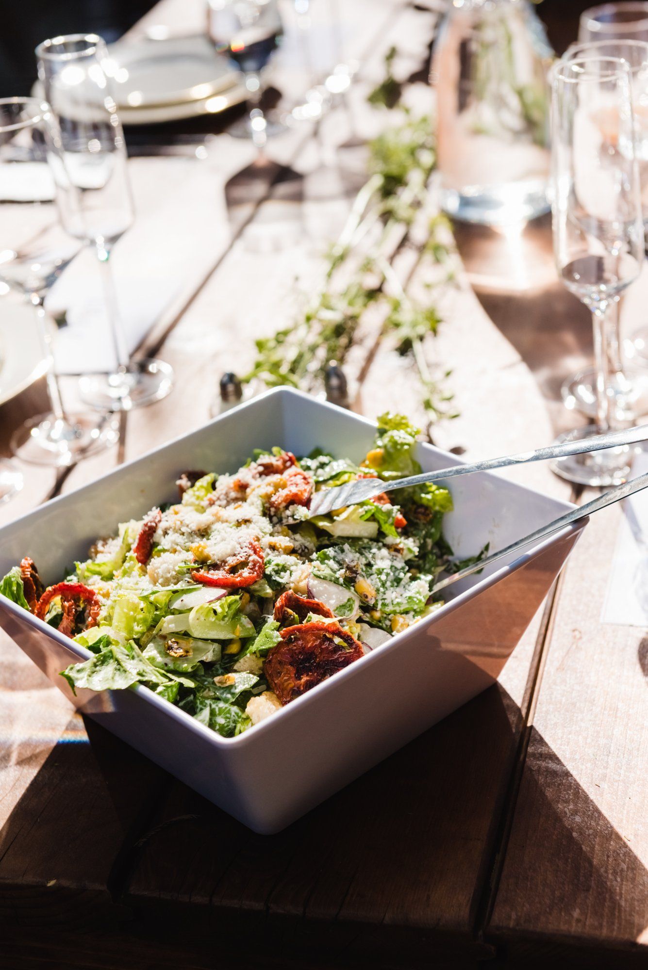 multicultural spring wedding at sand rock farm, A Family-Style Spring Dinner in the Barrel Room