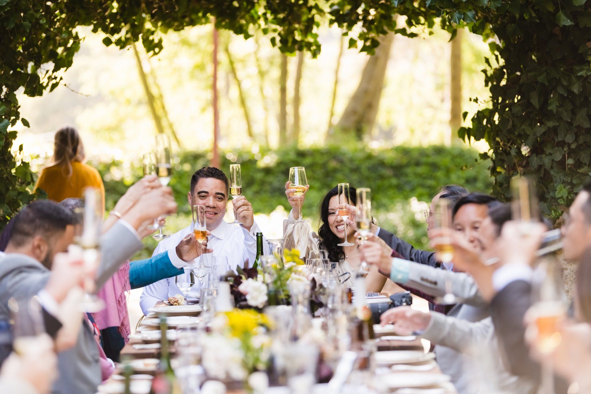 multicultural spring wedding at sand rock farm, A Family-Style Spring Dinner in the Barrel Room